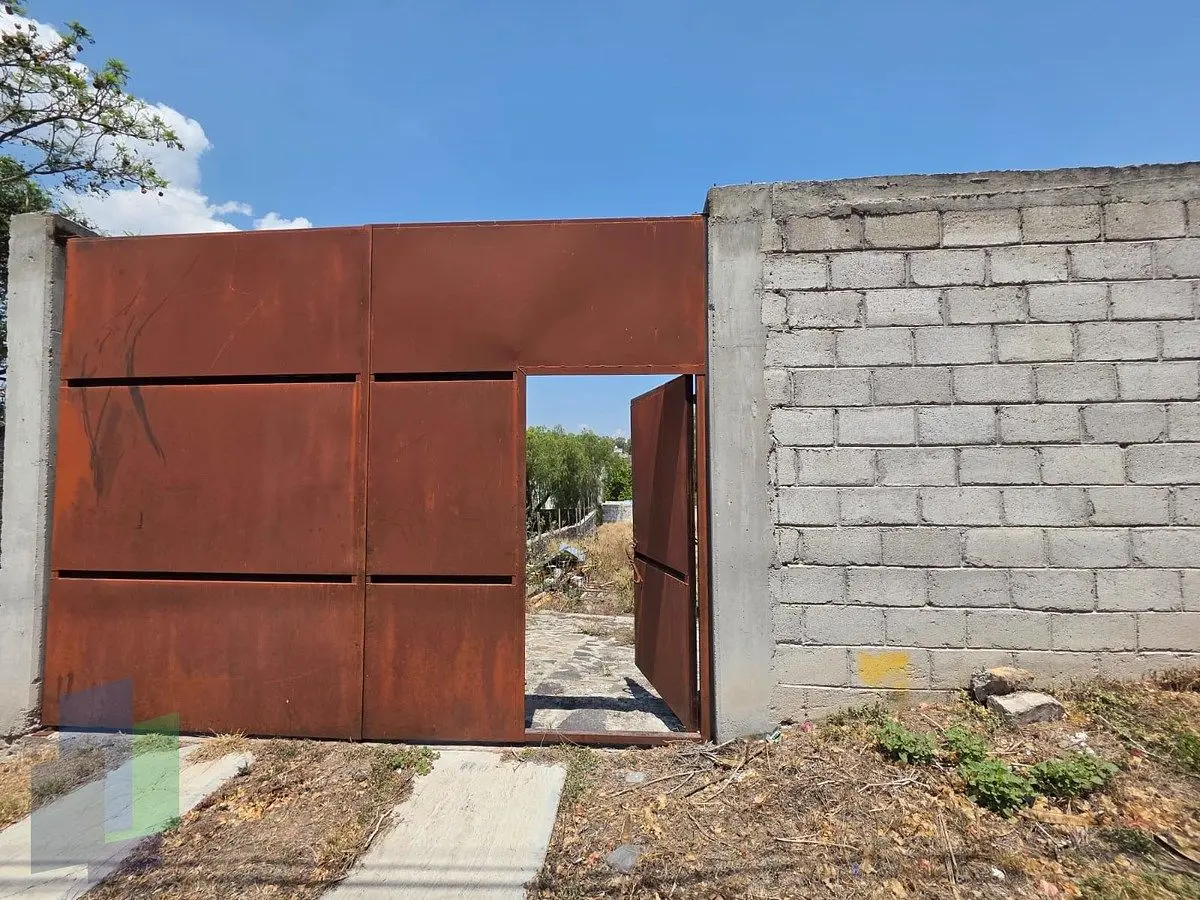 Terreno de 1000 en Villas del Mesón Juriquilla, con barda frontal y zagúan. — foto 4